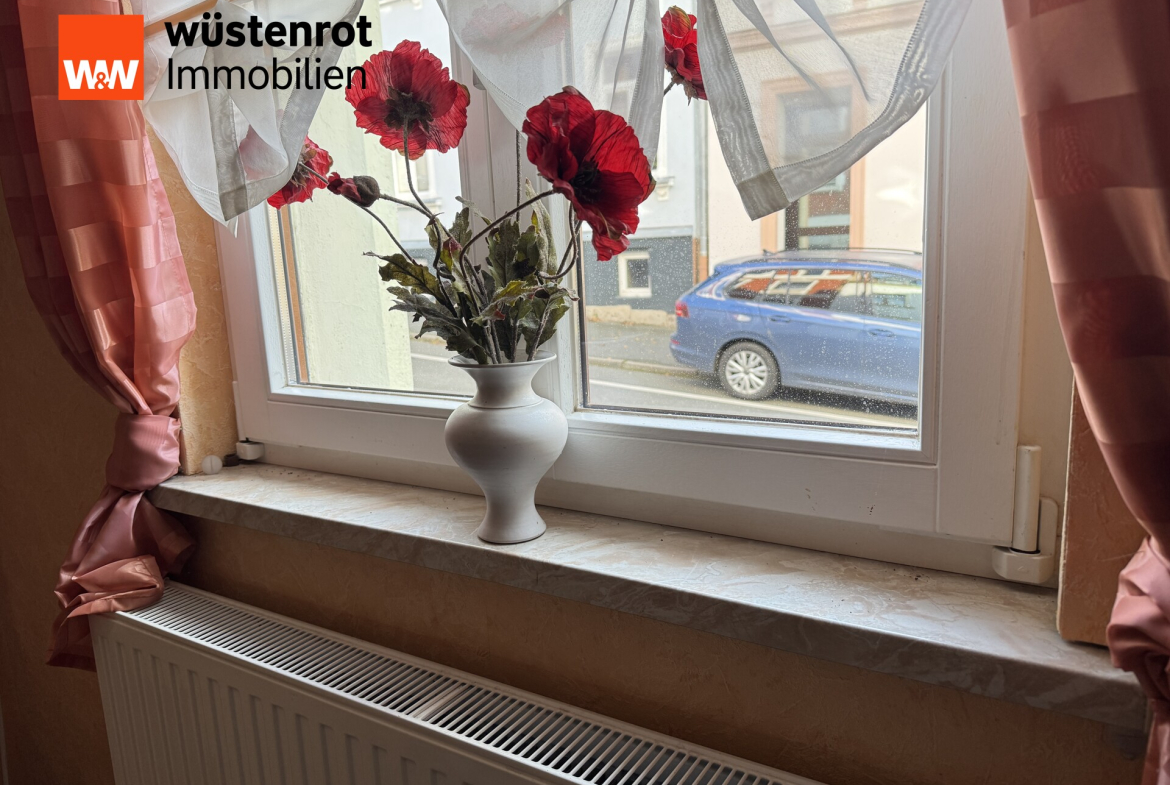 Detailansicht Heizkörper und Fenster